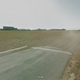 A street image from the track in 2011, when its small sign at the entrance to the parking area still welcomed spectators to Thunderhill Raceway. Image via Google Maps